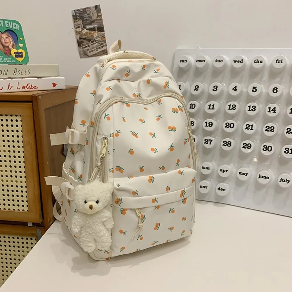sac d'école en nylon pour étudiants, sac à dos de grande capacité de style preppy pour femmes avec pendentif, sac à dos de voyage à motif floral