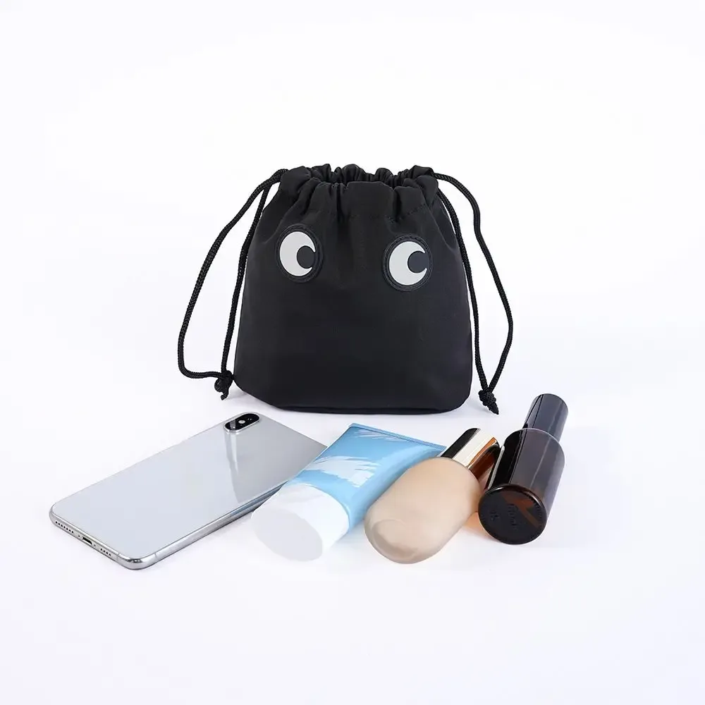 trousse de maquillage en nylon tendance avec cordon de serrage, motif dessin animé grands yeux, sac cosmétique mignon pour l'organisation des maquillages