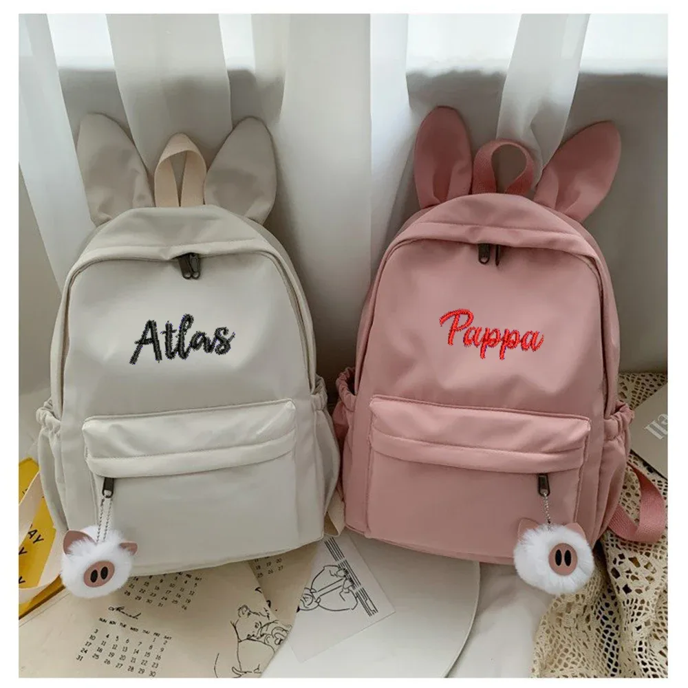 oreilles de lapin personnalisées et simples, nouvelle mode, sac à dos en tissu nylon, nom brodé personnalisé, sac d'étudiant pour hommes et femmes