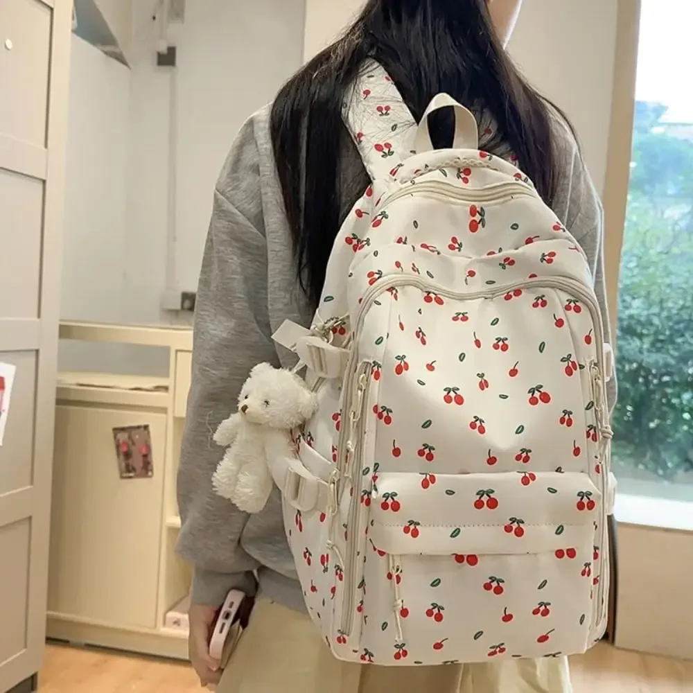 sac d'école en nylon pour étudiants, sac à dos de grande capacité de style preppy pour femmes avec pendentif, sac à dos de voyage à motif floral