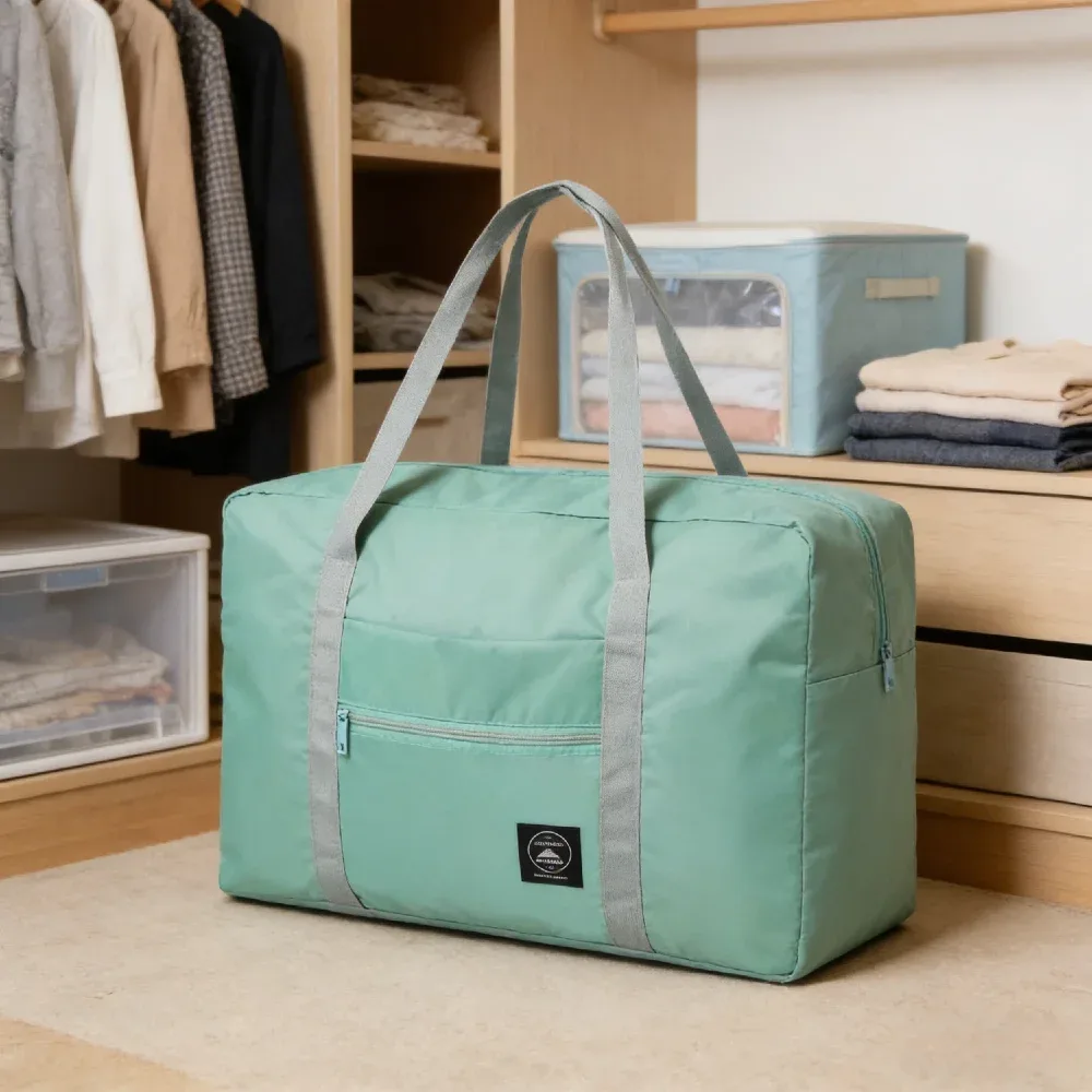 sac de voyage pliable de grande capacité, imperméable et résistant à l'usure, peut être porté à la main et stocké sur une épaule à la maison.