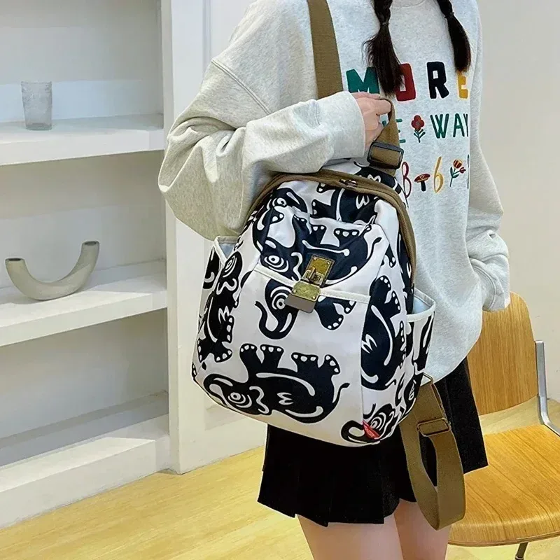 Sac à dos polyvalent pour femmes, impression tendance, grande capacité, sac à dos décontracté en tissu Oxford, nouveau cartable de voyage