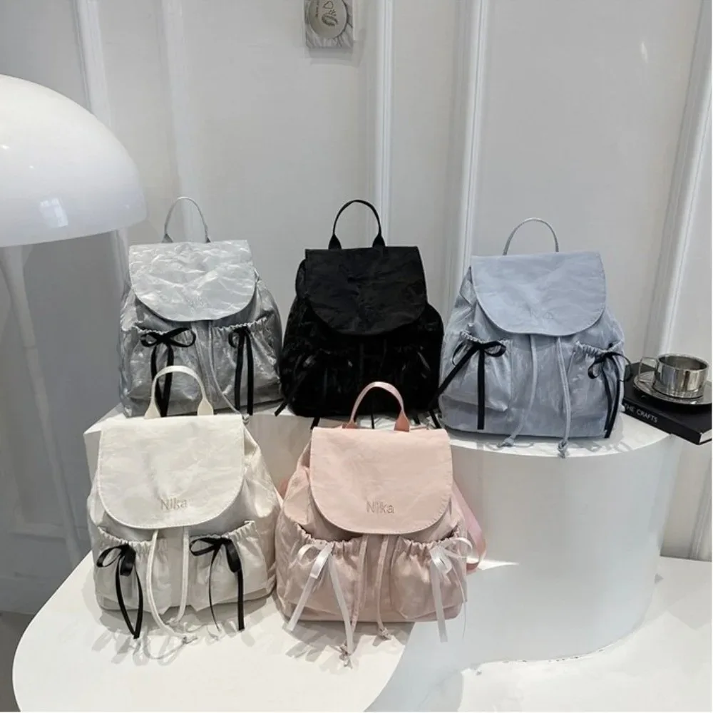 sac à dos à nœud mignon pour femmes, sac à dos avec cordon de serrage de grande capacité pour étudiants, sac de voyage de couleur unie pour l'extérieur