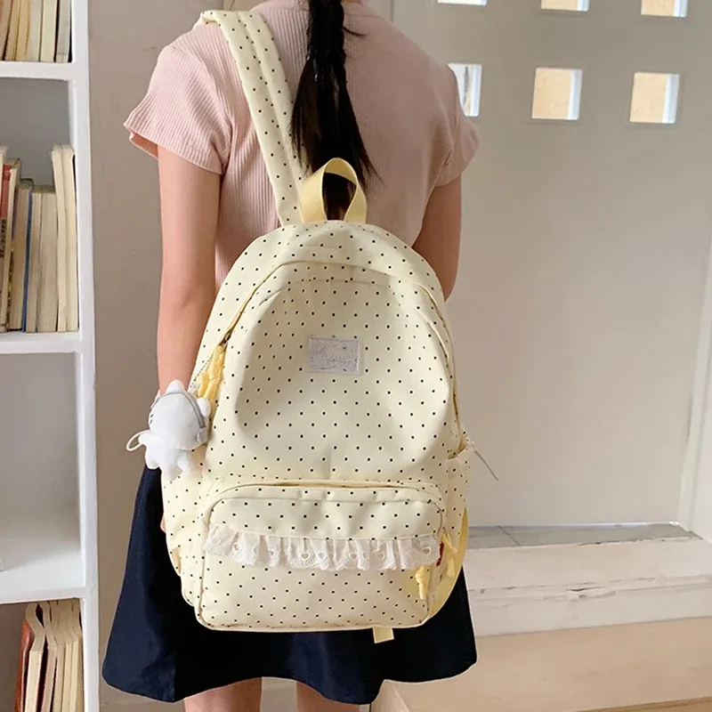 sac à dos tendance, sac d'école pour femmes à pois avec bordure en dentelle, mignon et élégant, sac à dos léger et de grande capacité pour étudiantes coréennes.