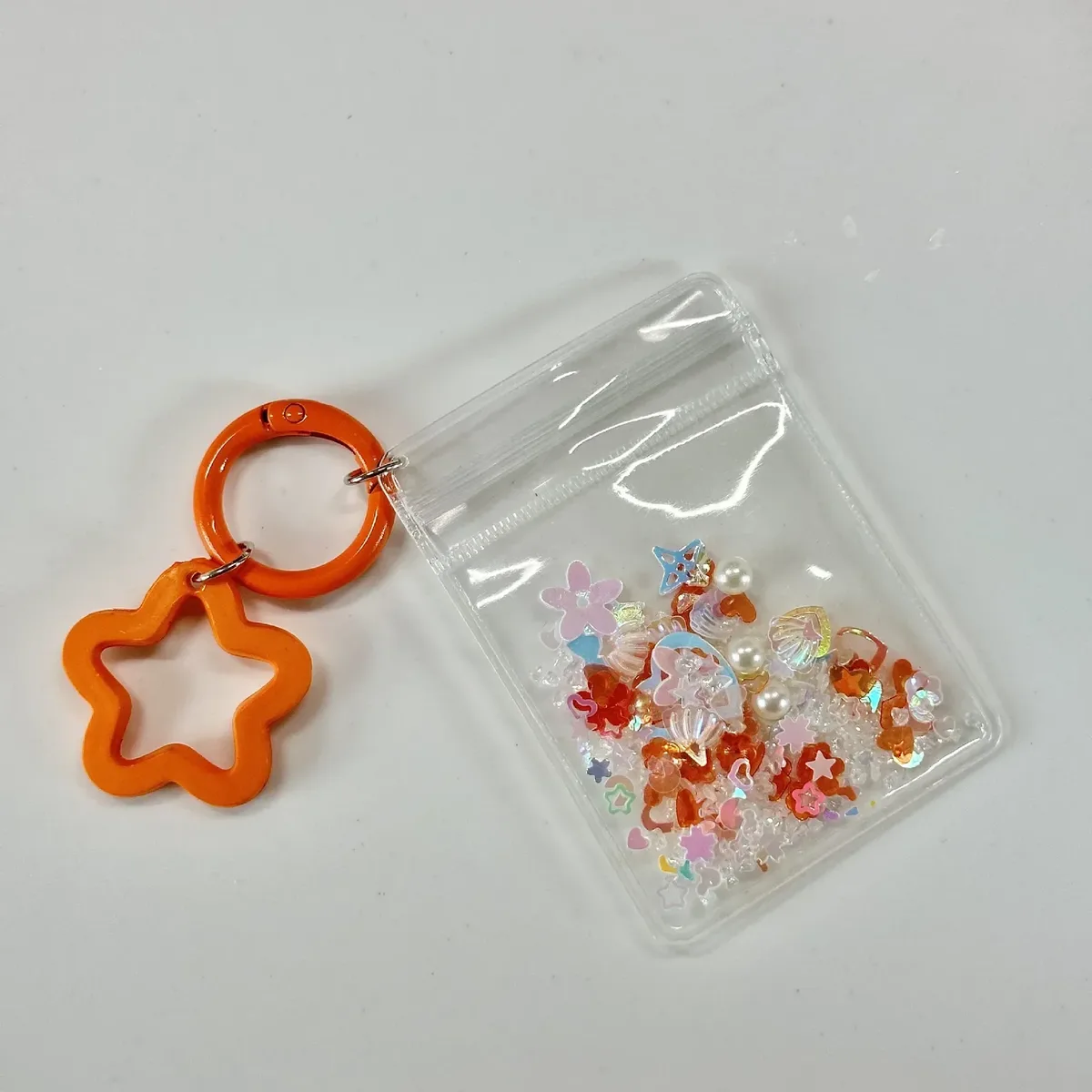 porte-clés mignon et tendance, mini sac de rangement transparent en forme d'étoile à cinq branches pour femme, pendentif pour sac et clés de voiture