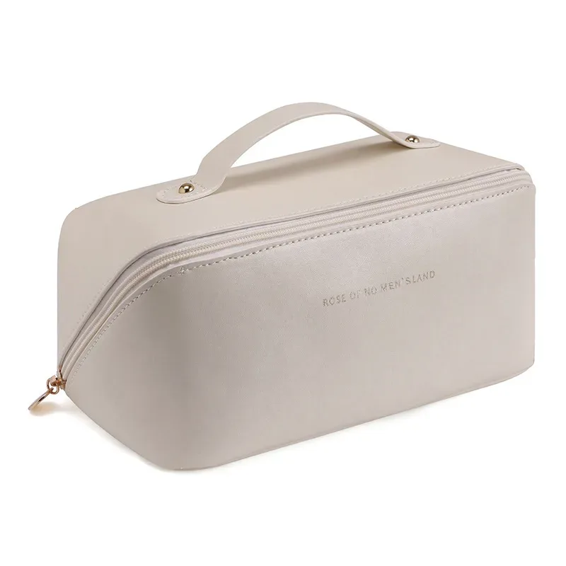 trousse de maquillage pratique et à la mode en pu, sac de rangement de voyage, trousse de toilette de grande capacité, trousse de maquillage pour oreiller de beauté stimulant les mains