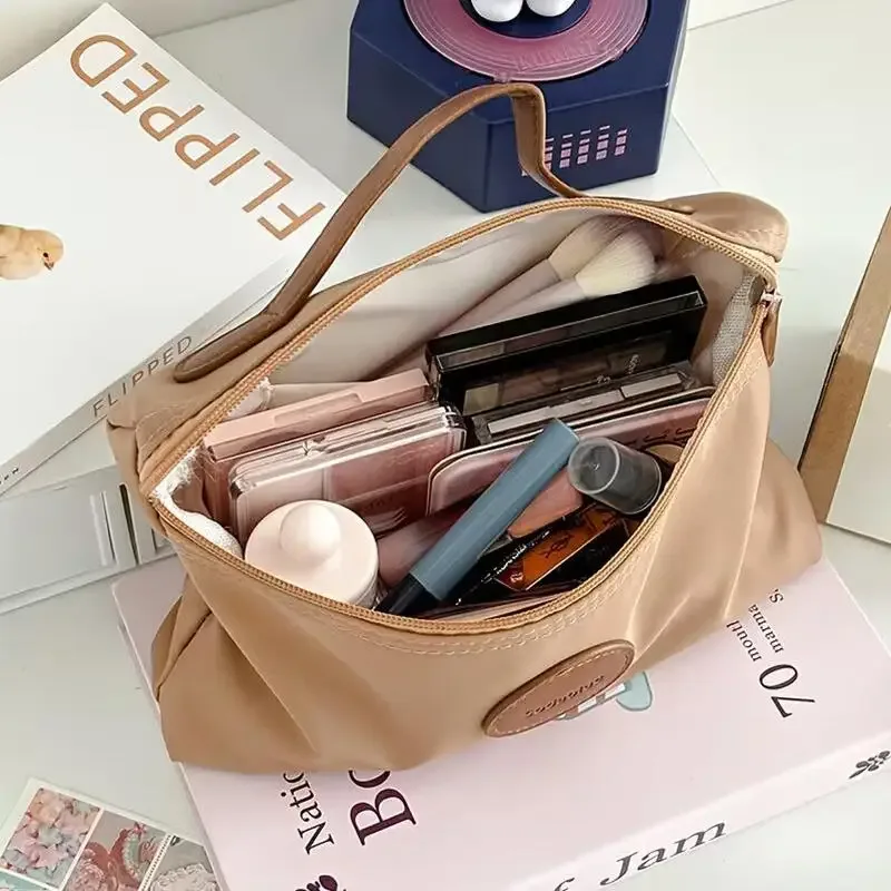 nouvelle trousse de maquillage portable 2026, sac cosmétique à main grande capacité en nylon, trousse de toilette de voyage pour femme, sac de rangement de voyage