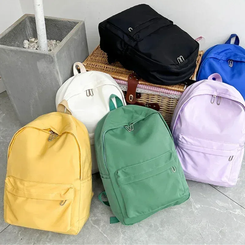 haute qualité nouveau imperméable à l'eau en nylon femmes sac à dos femme sac de voyage sacs à dos cartable pour adolescentes couleur unie bookbag