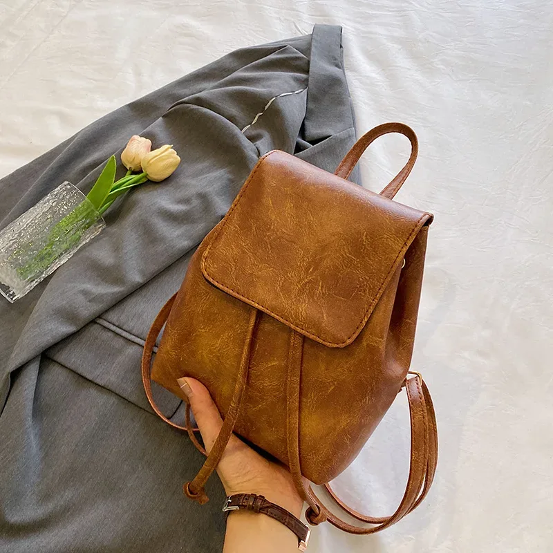 sac à dos à rabat en cuir pu pour femmes, petit sac à dos d'école texturé à cordon de serrage, sacs de voyage à la mode pour filles