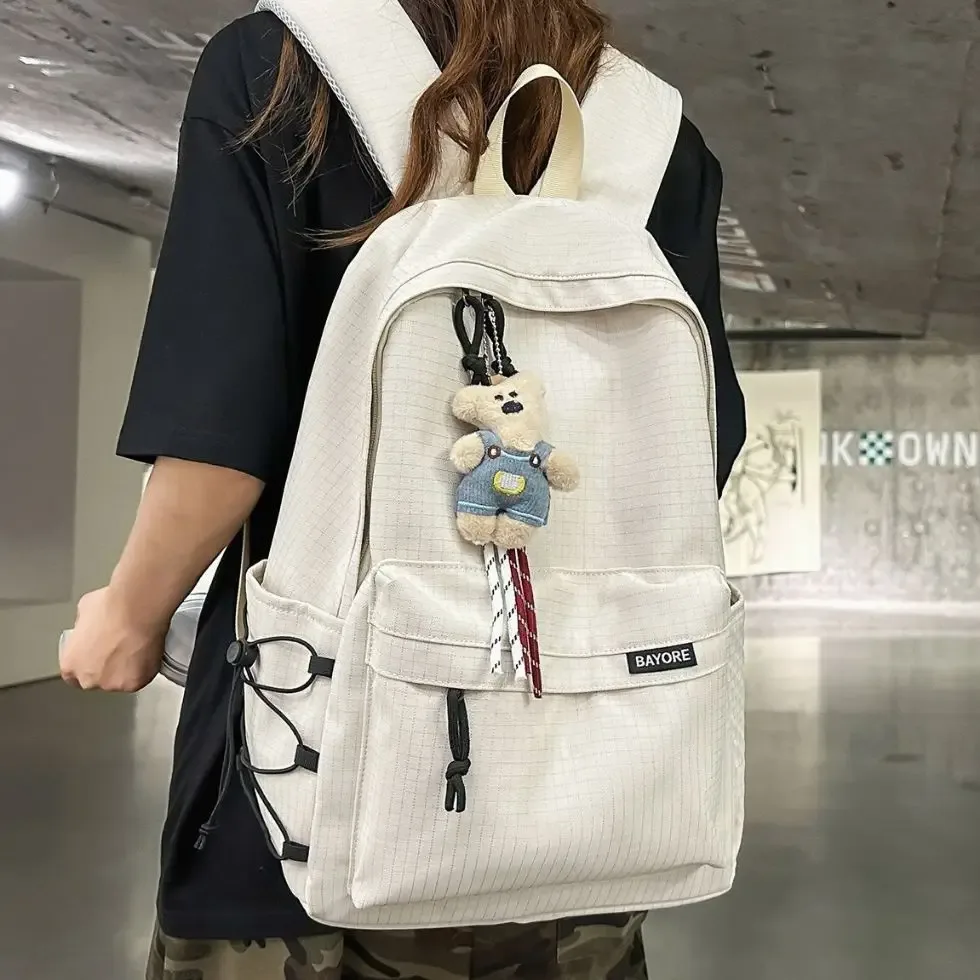 Sac à dos de voyage décontracté grande capacité pour homme, motif quadrillé simple, sac d'école en nylon, style campus jeune, système anti-gravité