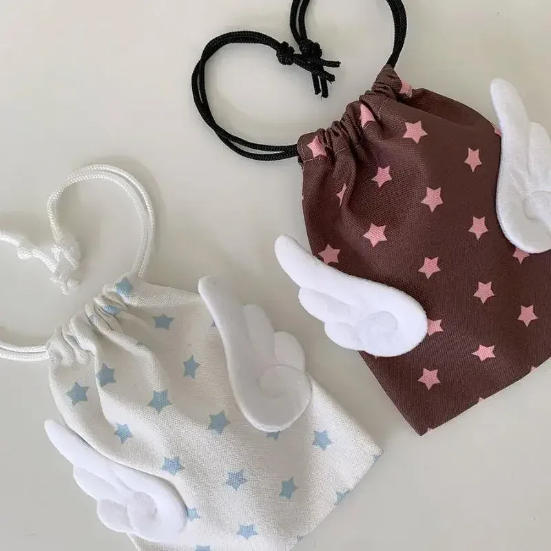 Toile chaude ailes d'ange étoiles sac de maquillage INS cordon sac de rangement Portable Bundle poche anti-poussière sac de rangement organisateur sac