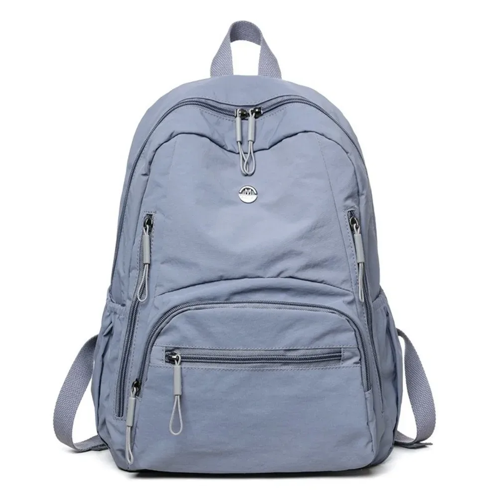 sac à dos minimaliste en nylon de grande capacité, fermeture éclair sécurisée, sac à dos léger et imperméable pour l'école et les voyages.