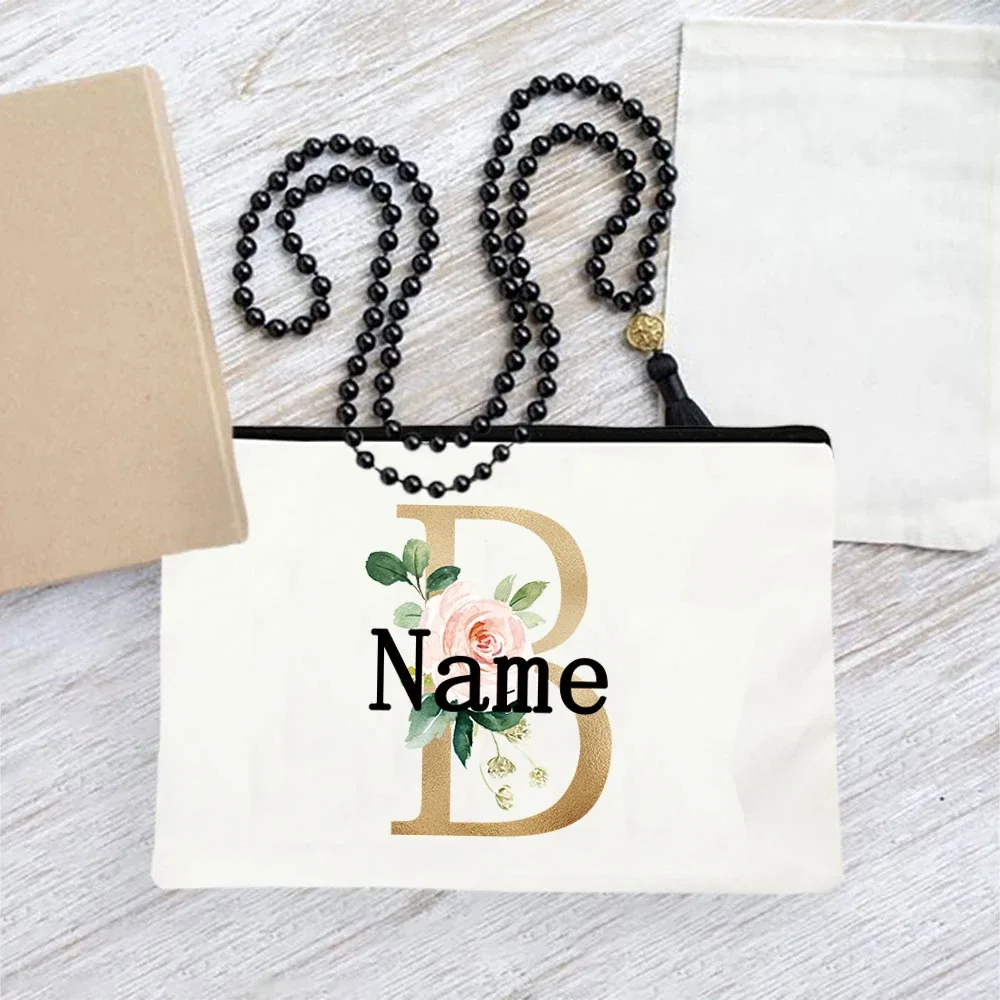 pochette en toile personnalisée avec initiales florales dorées, trousse de toilette légère personnalisée avec monogramme pour femmes, idéale pour les voyages quotidiens.