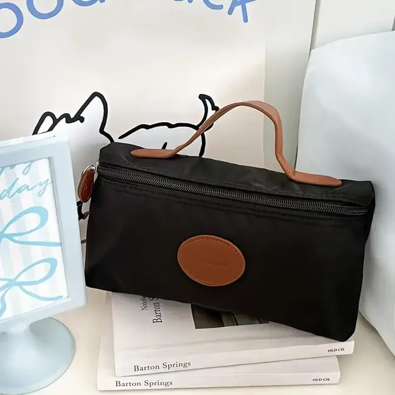 nouvelle trousse de maquillage portable 2026, sac cosmétique à main grande capacité en nylon, trousse de toilette de voyage pour femme, sac de rangement de voyage