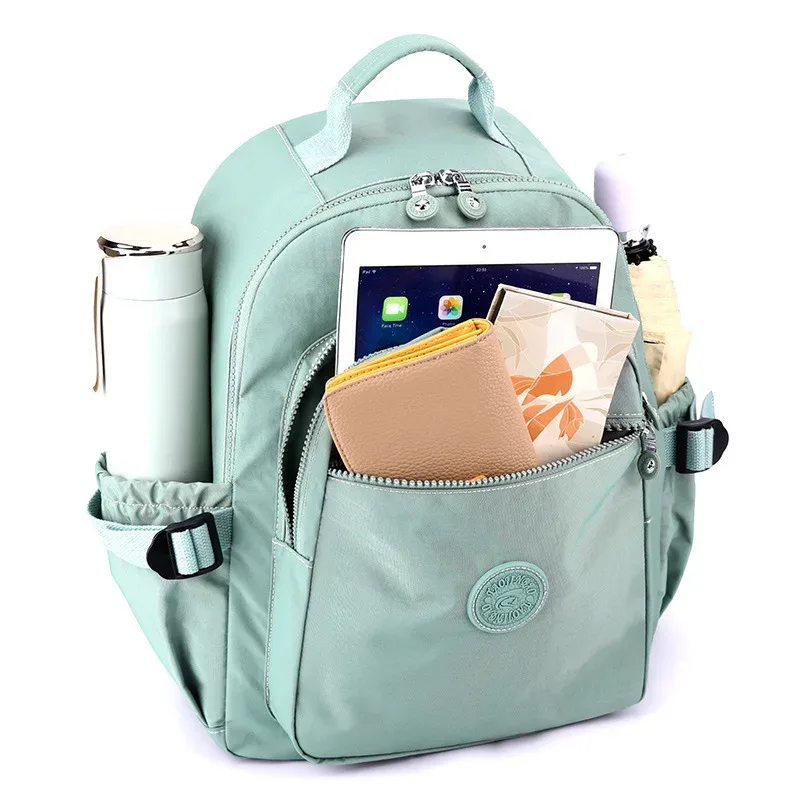 nouveau sac à dos de voyage pour femmes sac d'école en tissu nylon décontracté léger grande capacité à la mode double sacs à bandoulière en vente