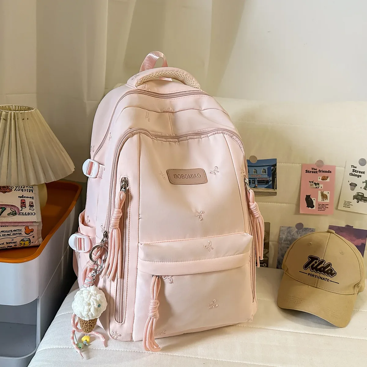 sac à dos traveasy 2026 nouveau motif nœud mignon polyvalent en nylon avec pendentif pompon protection dorsale pour étudiants