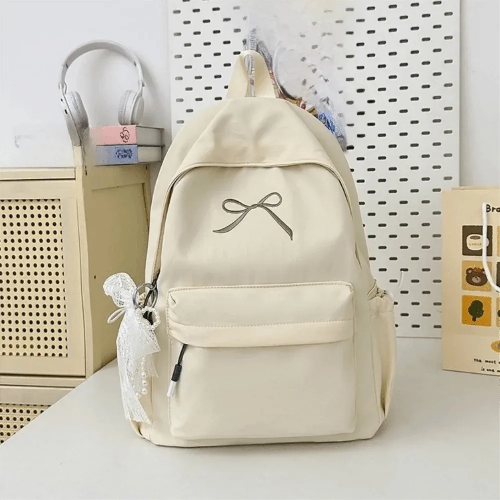 sac à dos pour filles avec nœud brodé, en nylon, grande capacité, léger, couleur unie, pour étudiants, sac d'école, sac de voyage