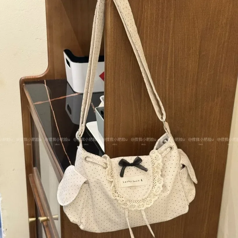 Sac à bandoulière coréen noir et blanc à pois avec dentelle, simple et mignon, avec nœud et cordon de serrage, pour étudiante