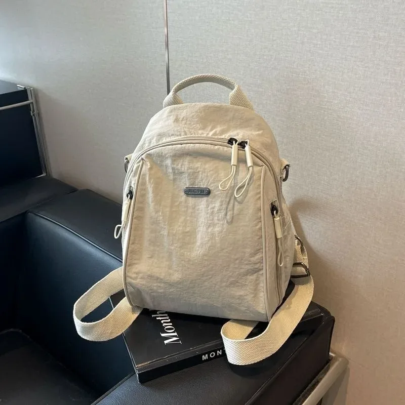 mini sac à dos multifonctionnel en nylon, sac de voyage convertible décontracté à bandoulière pour femme, sac à dos quotidien multi-poches pour l'extérieur