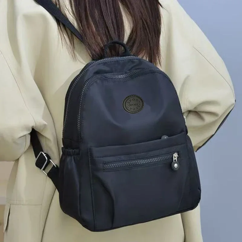 sac à dos multicolore pour femme avec logo rond, sac à bandoulière à la mode pour femme en différentes couleurs