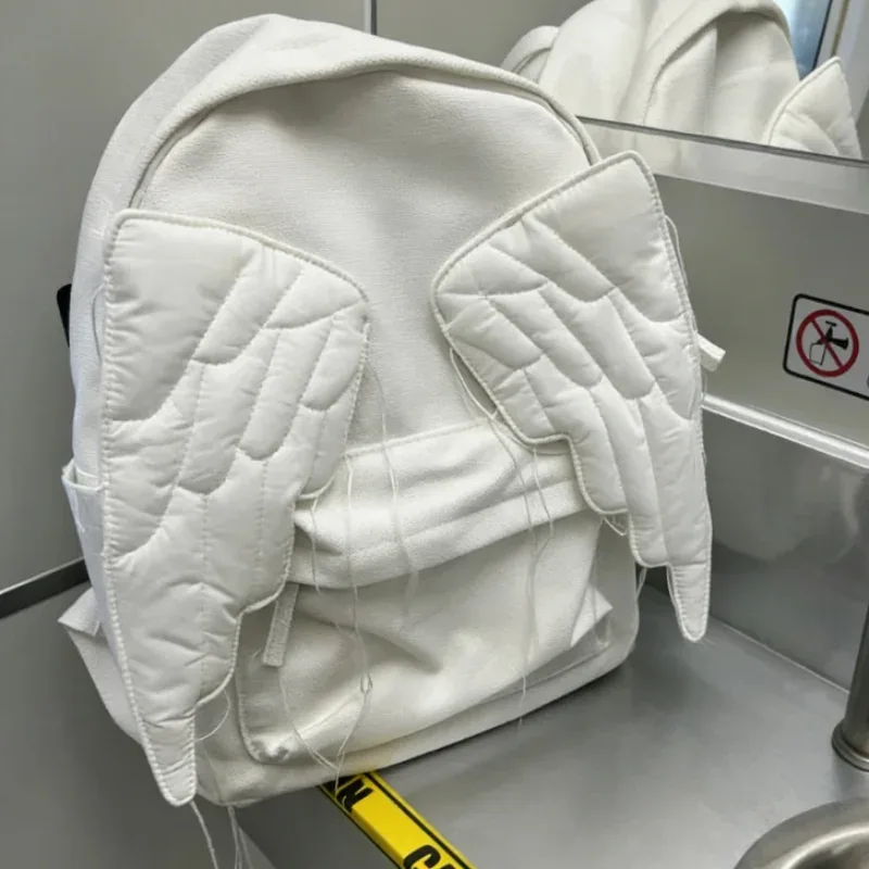 Sac à dos à ailes Style Y2k pour femmes, sac en toile d'ange mignon japonais, pompon créatif, couleur unie, sac à bandoulière de grande capacité pour étudiantes