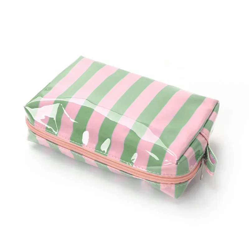 sac cosmétique rayé en pvc avec pompons et fermeture éclair, trousse de toilette de voyage imperméable avec organiseur de pinceaux de maquillage intégré.