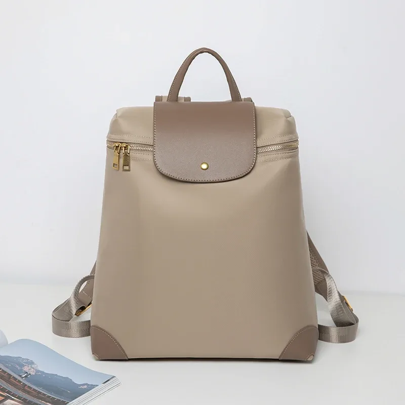 "sac à dos élégant de grande capacité pour femmes |   durable et résistant aux taches |   pliable léger |   sac à dos de voyage étanche"