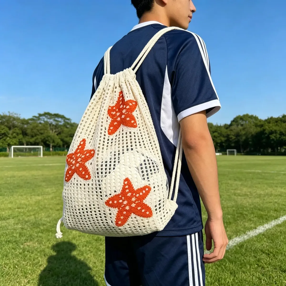 Sac à dos tendance en maille brodée étoile de mer ajourée - Grande capacité avec cordon de serrage, motif étoile de mer orange, peut contenir un ballon de basket, un ballon de football et des équipements de camping, en fibre de polyester beige, idéal pour les accessoires de vacances en plein air, style décontracté, sac à dos de rangement multifonctionnel, sac de rangement parfait pour les vacances, sac de rangement pour ballon de football, sac à dos cadeau pour célébrations et commémorations, unisexe, adapté à toutes les saisons