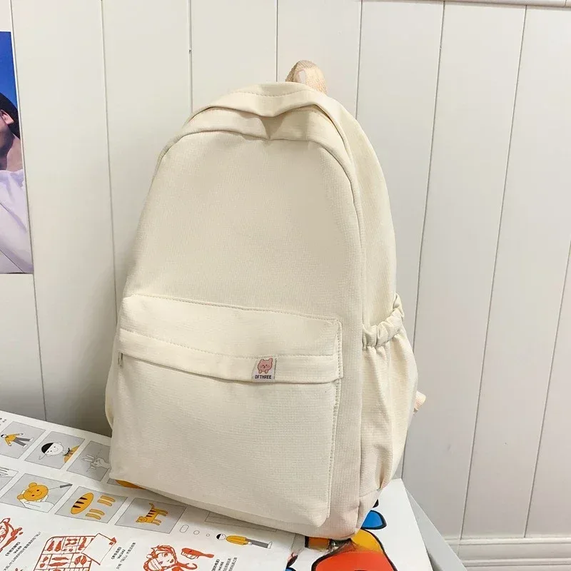 nouveau sac à dos imperméable en nylon pour femmes, sac de voyage, cartable pour adolescentes, sac à livres de couleur unie