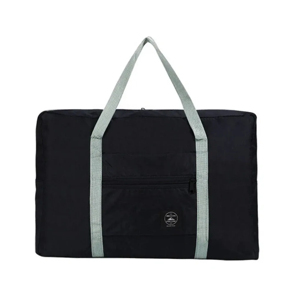 sac de voyage pliable de grande capacité, imperméable et résistant à l'usure, peut être porté à la main et stocké sur une épaule à la maison.