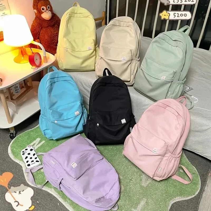 nouveau sac à dos imperméable en nylon pour femmes sac de voyage pour femmes sacs à dos cartable pour adolescentes couleur unie bookbag mochila bookbag
