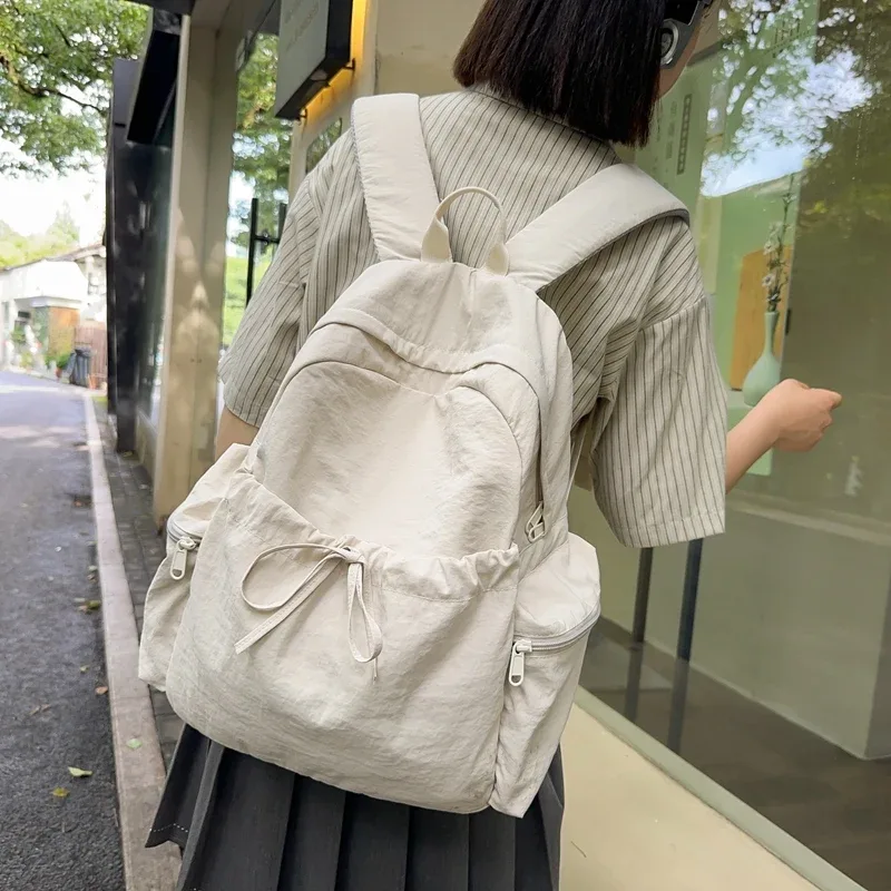 nouveau sac à dos mignon de couleur unie pour femmes, sac à dos de loisirs en nylon pour étudiantes, cartable pour adolescentes, sac à dos de voyage à la mode