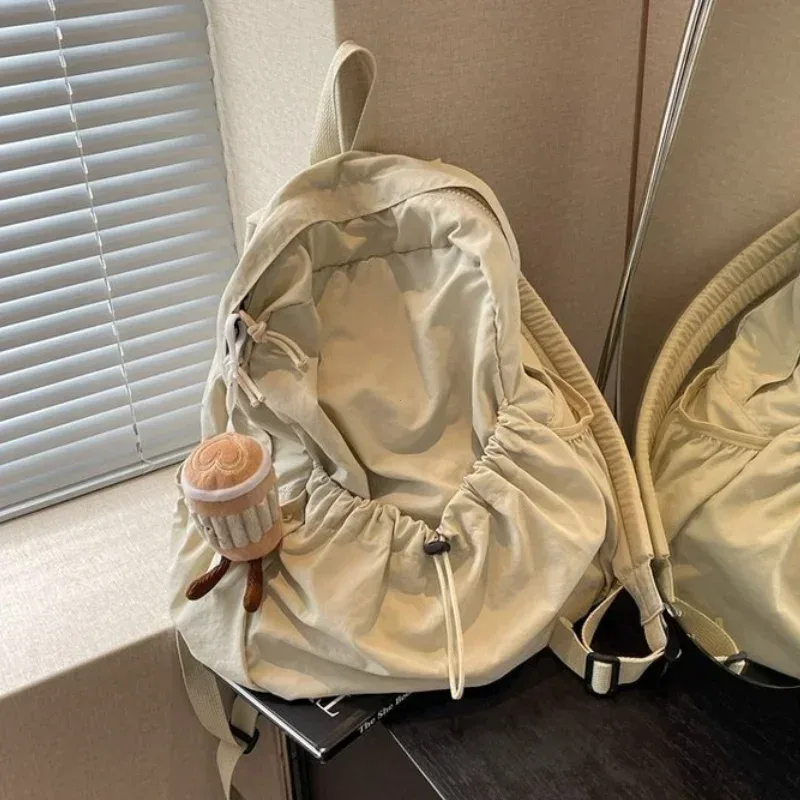 2025 sac à dos décontracté femmes grande capacité mode junior lycée étudiant pli cartable sac en tissu coréen voyage sac à dos
