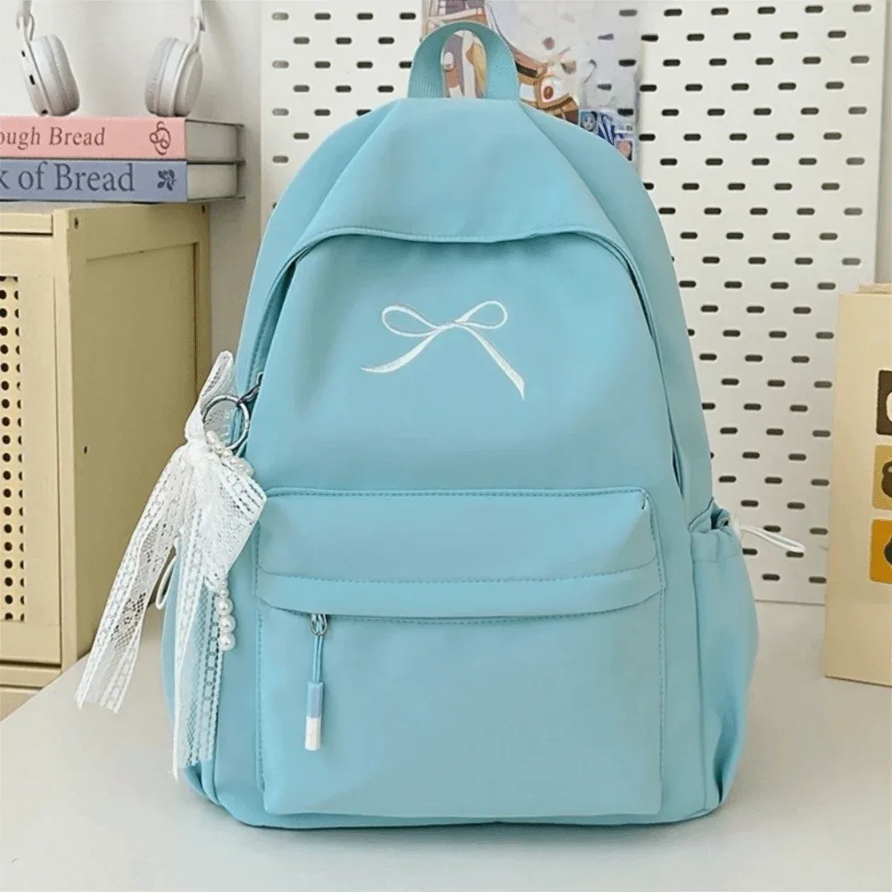 sac à dos portable avec nœud brodé pour filles, cartable en nylon de grande capacité pour étudiants, sac à dos de voyage léger de couleur unie