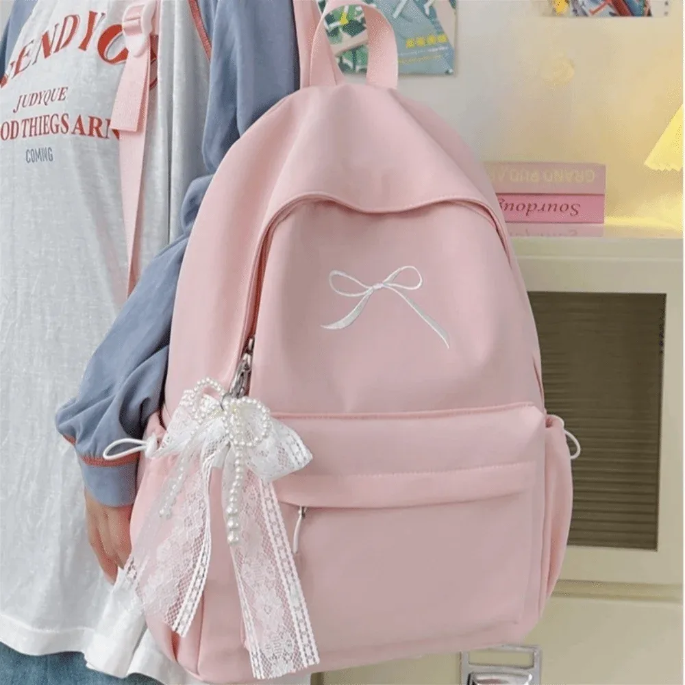 Sac à dos pour filles avec nœud brodé, en nylon, grande capacité, léger, couleur unie, pour étudiants, sac d'école, sac de voyage