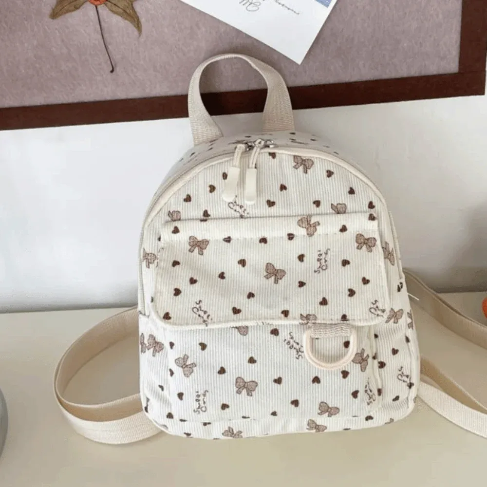 mini sac à dos en velours côtelé léger avec imprimé cœur et nœud, sac à dos décontracté multi-compartiments à ouverture zippée pour l'école