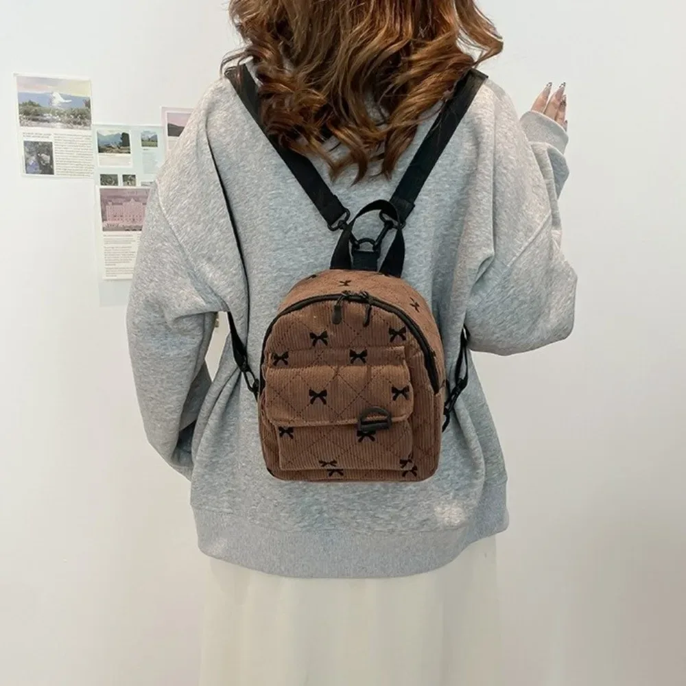 Sac à dos mini décontracté en velours côtelé, imprimé nœud papillon, sac à dos multi-nœuds, sac de rangement pour cosmétiques, sac à bandoulière léger pour les trajets quotidiens