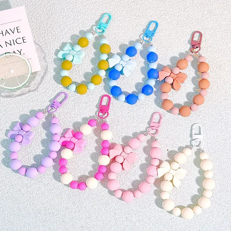 Porte-clés avec nœud en perles roses, chaîne pour téléphone portable, sac pour écouteurs, corde Anti-perte, porte-clés de voiture, pendentif perlé, accès au pendentif pour sac à dos