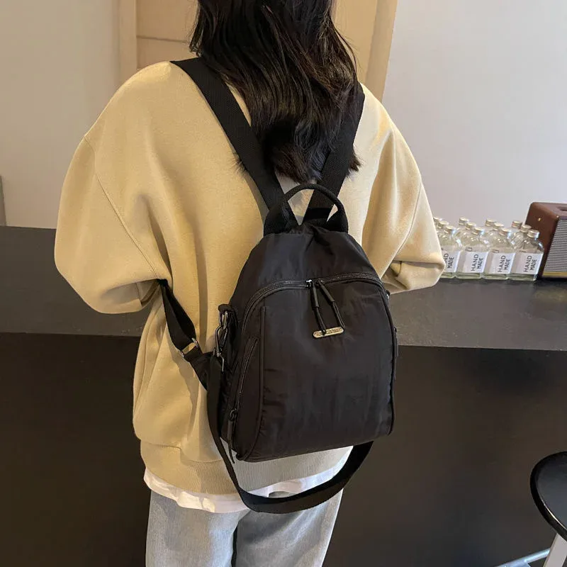 mini sac à dos multifonctionnel en nylon, sac de voyage convertible décontracté à bandoulière pour femme, sac à dos quotidien multi-poches pour l'extérieur