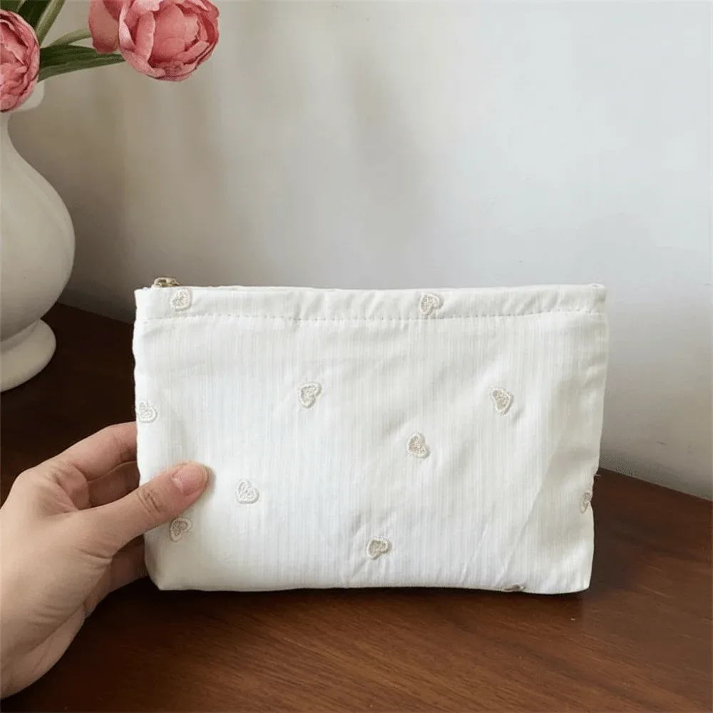 pochette à maquillage classique à rayures, motif brodé, fermeture éclair lisse, organiseur de cosmétiques, couleurs pastel, taille compacte, trousse de toilette