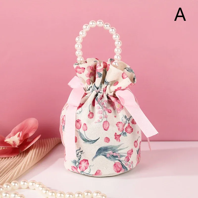 sac à cordon en toile florale, petite pochette à bijoux avec nœud papillon avec poignée en chaîne de perles, sac d'emballage de bonbons de mariage
