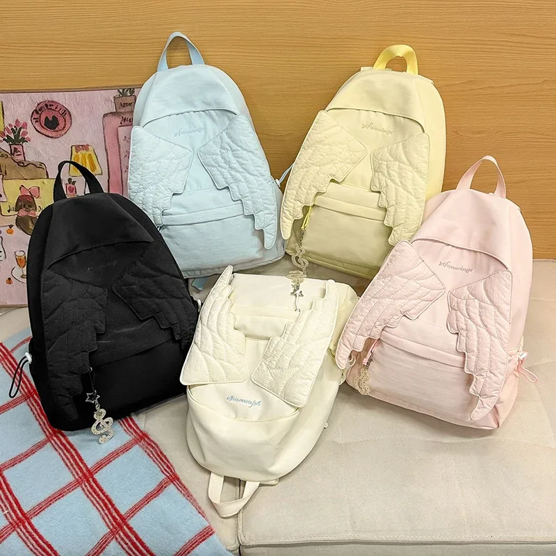 sac à dos ailes d'ange de marque pour filles, niche douce et polyvalente, en toile, nouveau sac de voyage tendance y2k avec pompon, grande capacité