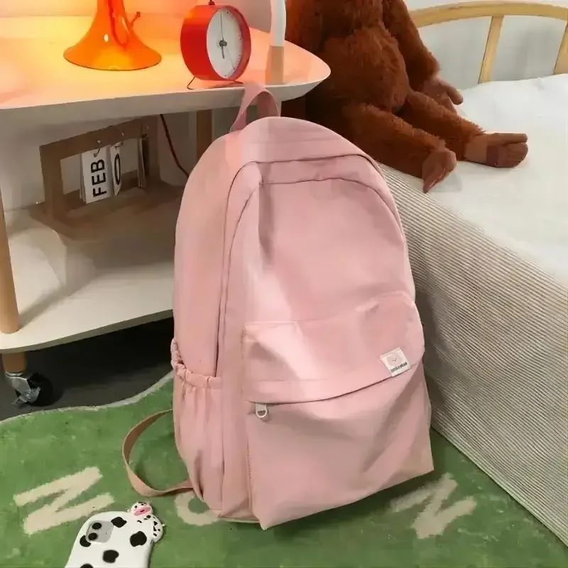 nouveau sac à dos imperméable en nylon pour femmes, sac de voyage, cartable pour adolescentes, sac à livres de couleur unie
