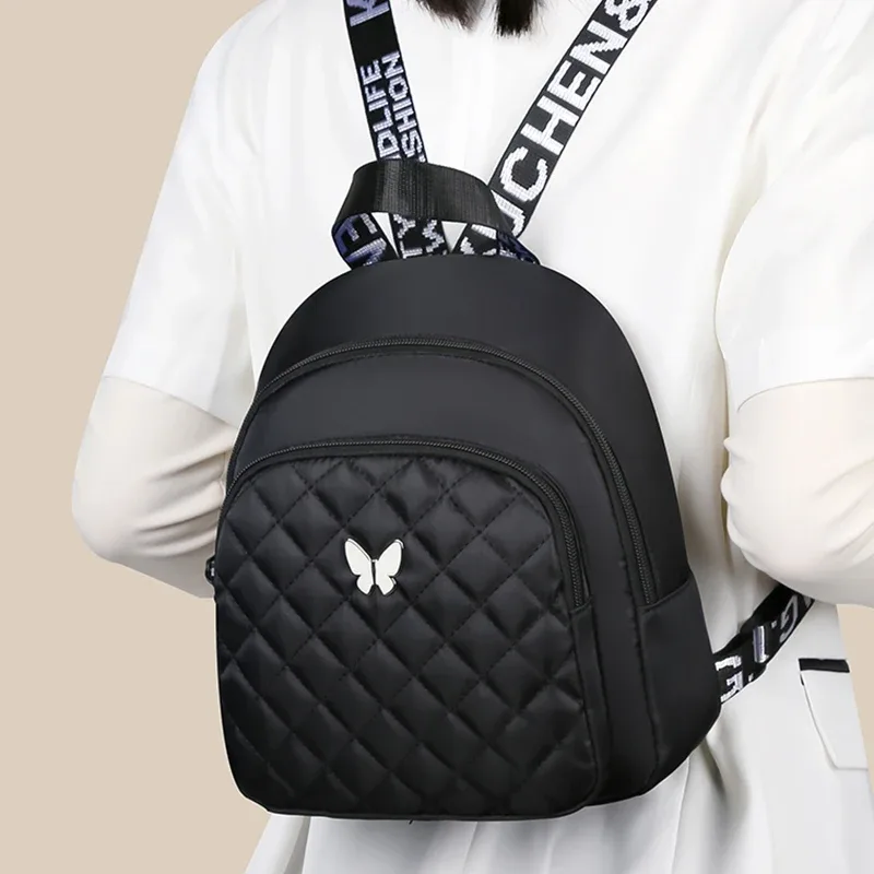 sac à dos matelassé multicolore pour femmes, avec accent papillon, pour les sorties quotidiennes, les déplacements quotidiens, sac décontracté léger et pratique