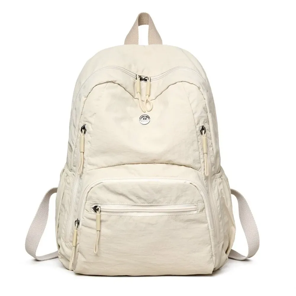 sac à dos minimaliste en nylon de grande capacité, léger, avec fermeture éclair sécurisée, sac à dos durable et imperméable pour l'école et l'utilisation quotidienne.
