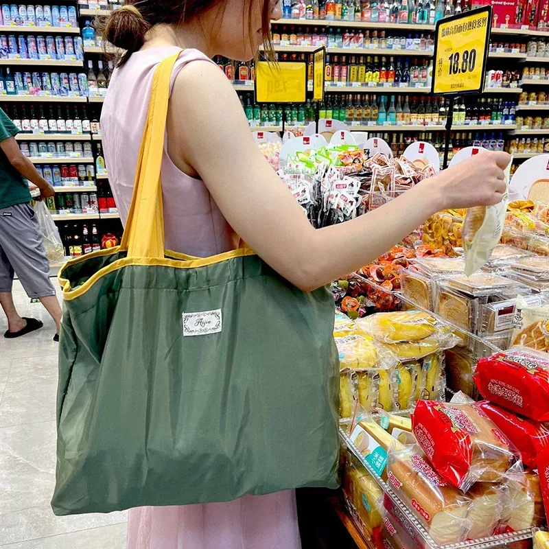 Nouveau sac à bandoulière pliable en promotion, sac de shopping tendance imperméable et grande capacité, sac de rangement portable pour usage quotidien