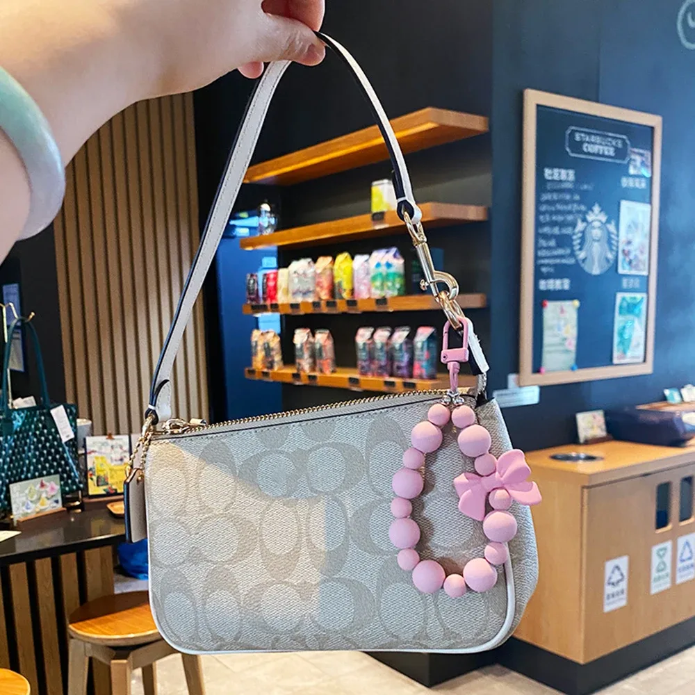 porte-clés avec nœud en perles roses, chaîne pour téléphone portable, sac pour écouteurs, corde anti-perte, porte-clés de voiture, pendentif perlé, accès au pendentif pour sac à dos