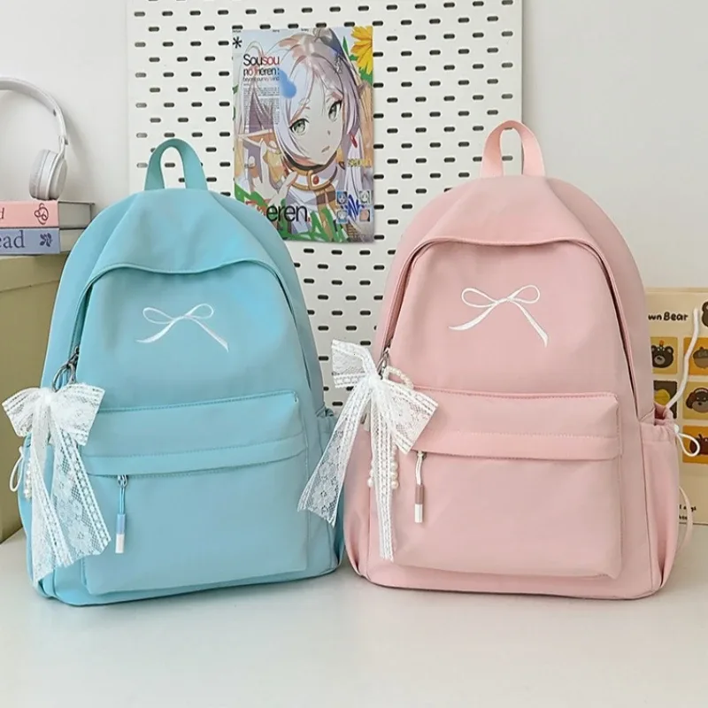 sac à dos portable brodé avec nœud pour filles, sac d'école en nylon de couleur unie pour étudiants, sac à dos de voyage léger de grande capacité pour femmes