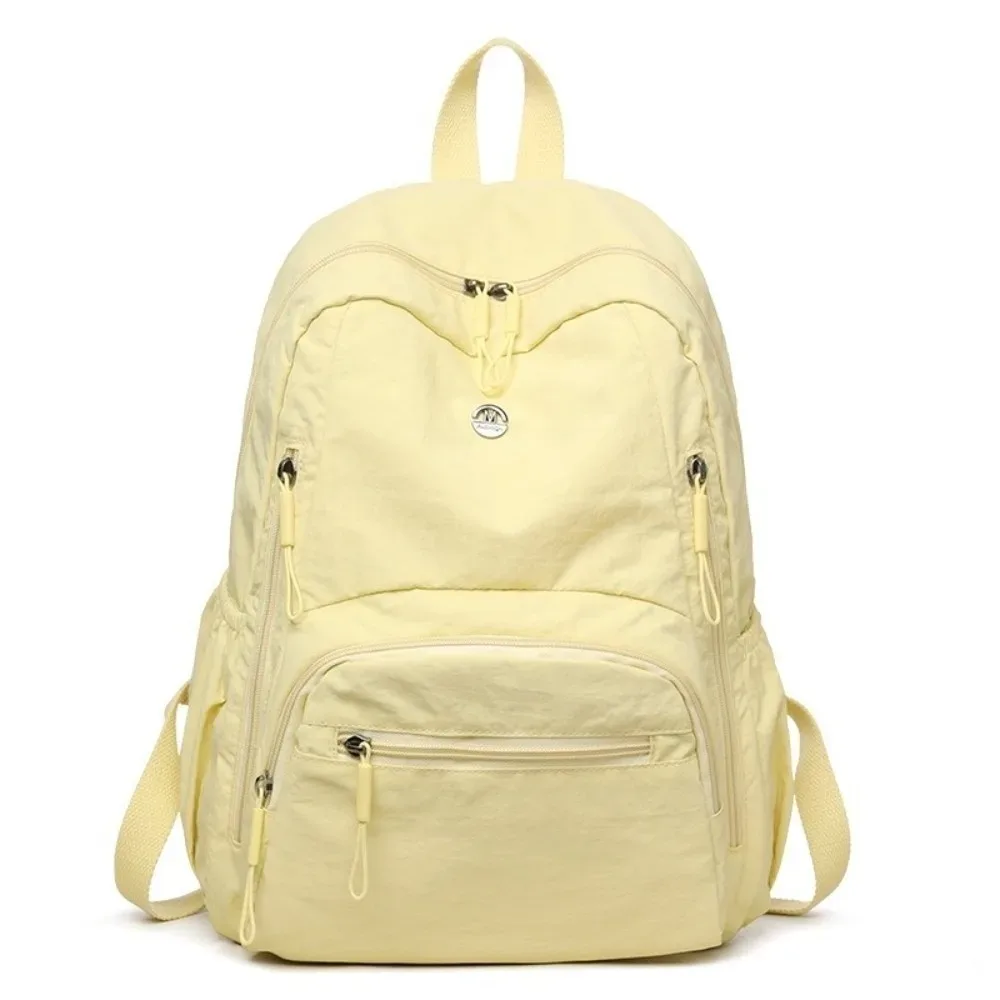 sac à dos minimaliste en nylon de grande capacité, fermeture éclair sécurisée, sac à dos léger et imperméable pour l'école et les voyages.