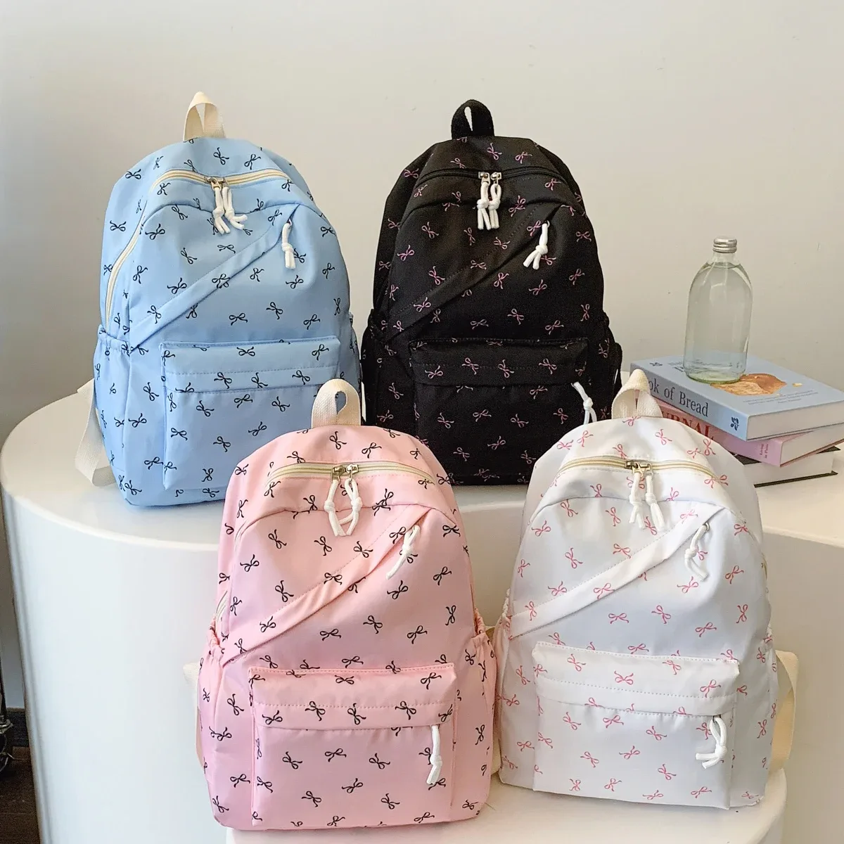 sac à dos tendance et mignon avec imprimé de nœuds, sac à dos pour ordinateur portable avec protection pour ordinateur portable, bretelles réglables, sac à dos pour ordinateur portable pour la rentrée scolaire.